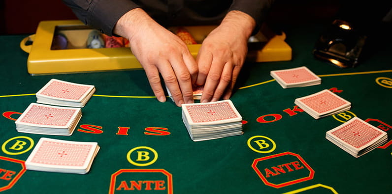 Dealer Shuffling Cards at a Table